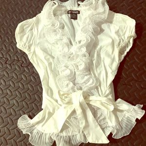 White ruffled blouse